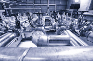 Industry oil and gas pipes, concept of industry systems, steel pipelines, blue toned.